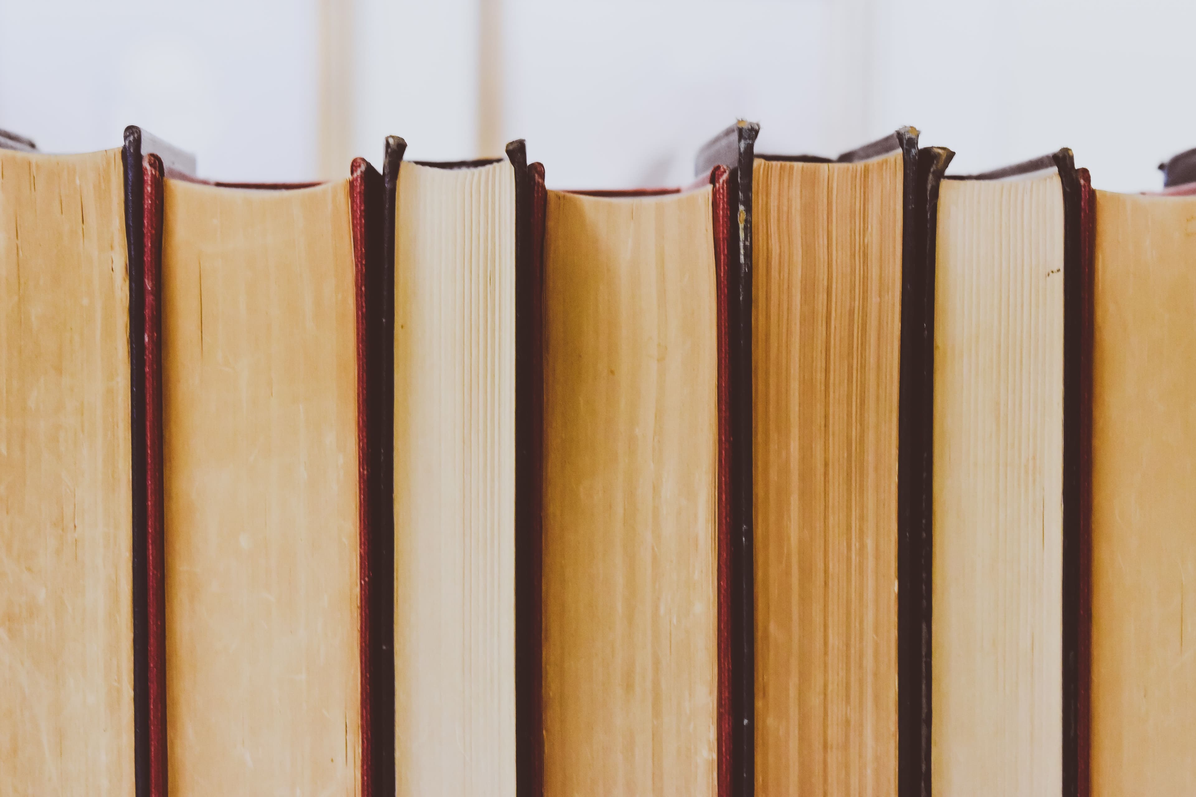 Background hero image of books on shelf